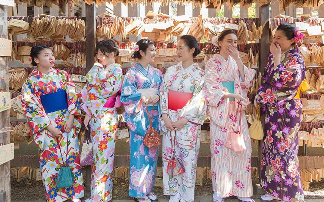 Tourists wearing traditional rented kimonos walking down Little Edo Kawagoe.